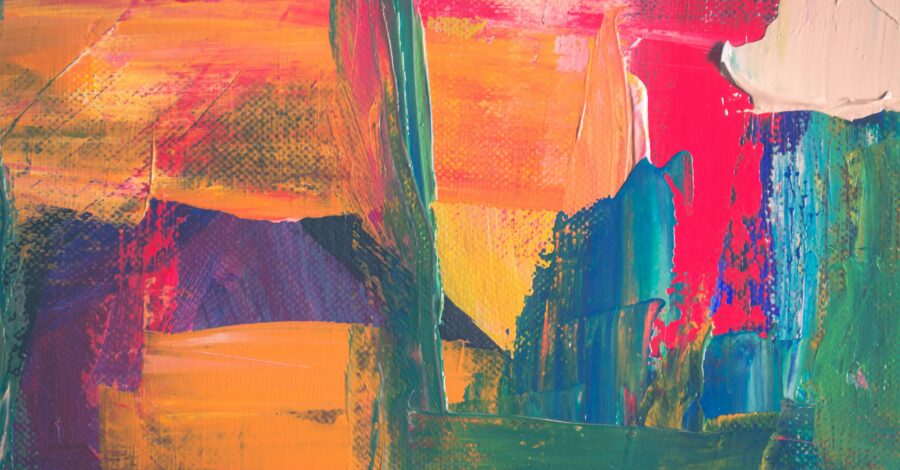 abstract image - mainly yellow/orange with splashes of blue and green