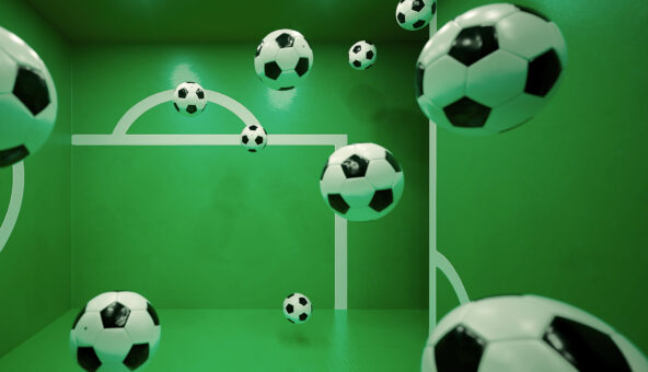 Multiple floating footballs inside a green room with white goalpost markings on the walls. The perspective and reflections create an illusion of depth, making it appear as if the balls are suspended in mid-air.