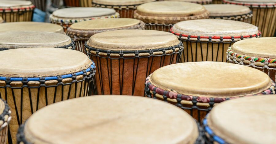 A number of large drums laid out in rows.