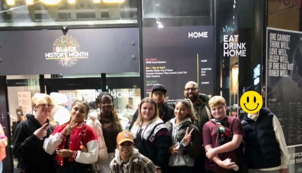 A grioup of young people stood outside HOME Manchester.