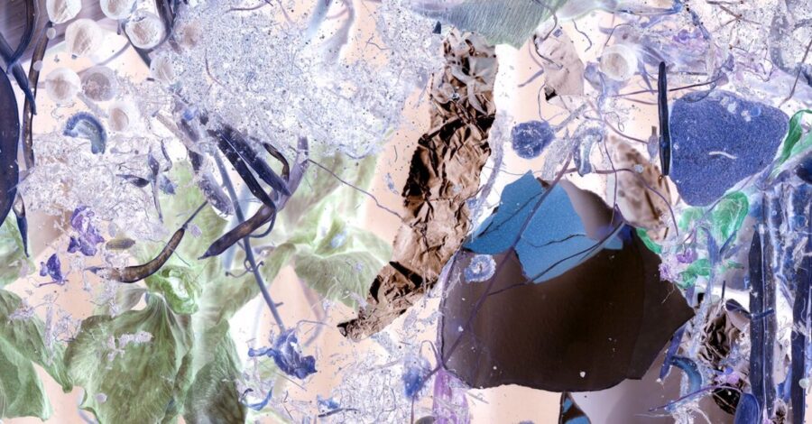 Different materials layered over eachother, collaged and layered in shades of deep purple and light green, watery blues.