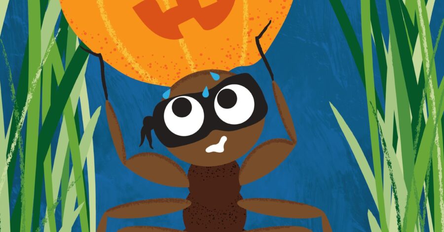A cartoon ant in long green grass lifting a large orange pumpkin mask