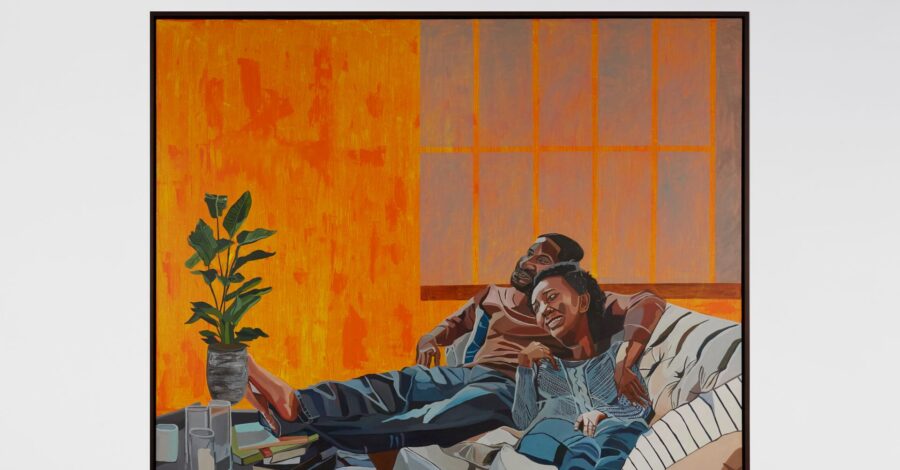 A painting of a man and a woman sat relaxing on a chair together. They look happy and the man has his arm around the woman. The room is painted in a warm orange colour and there is a green house plant in the background.
