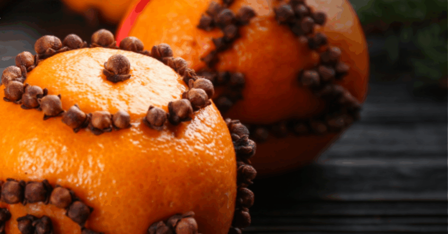 Pomanders that have been created by sticking cloves into an orange.