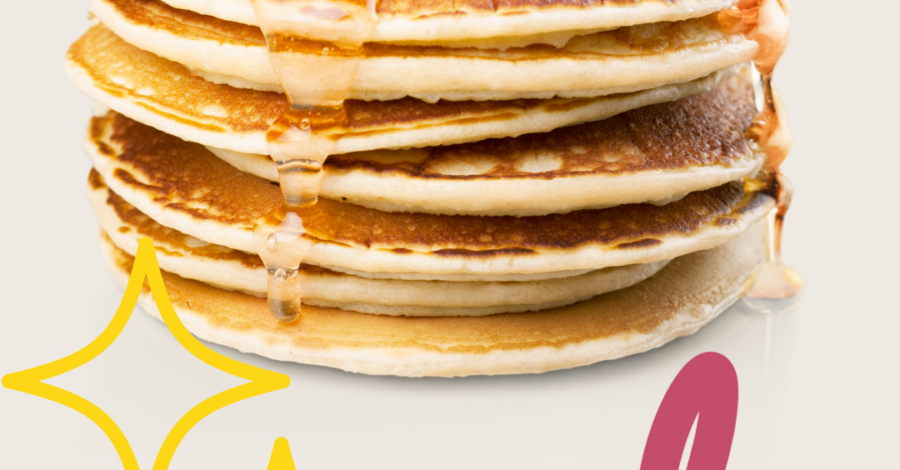 A pile of pancakes with a knob of butter and some syrup poured over the top.