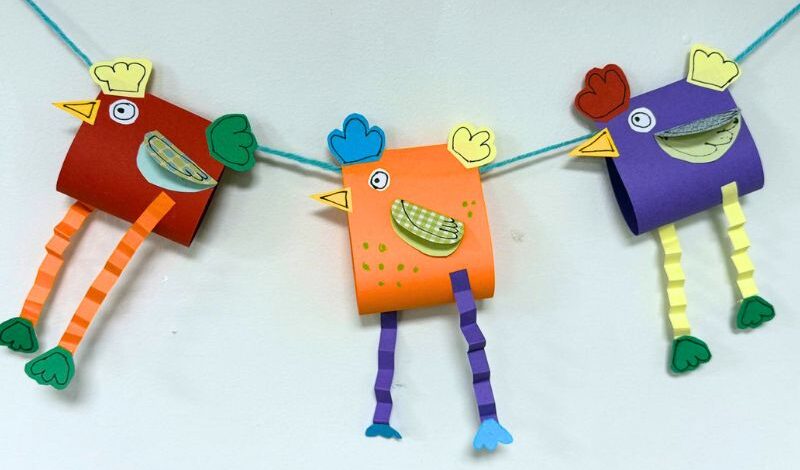 A chain of bunting with paper-crafted chickens for flags.