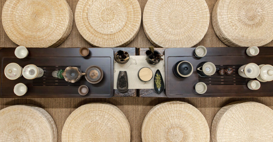 A tea ceremony set up, cups, saucers and other equipment