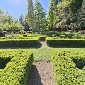 The Shakespeare Garden in Platt Fields Park in Fallowfield with well manicured hedges.