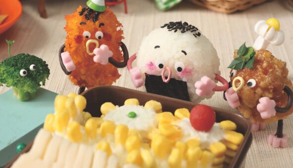 A scene from a film featuring animated piece of foof. There is a chilcken nugget, a ball of rice and some sweetcorn - all with faces.
