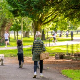 People walking through a park.