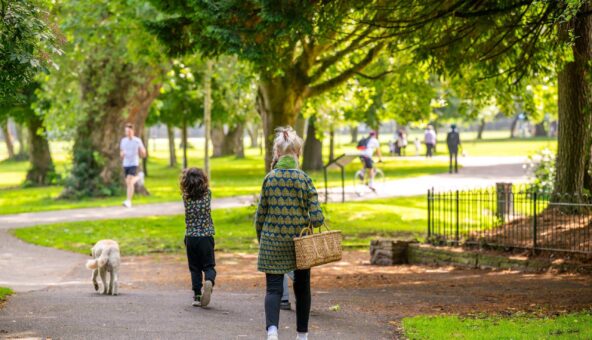 People walking through a park.