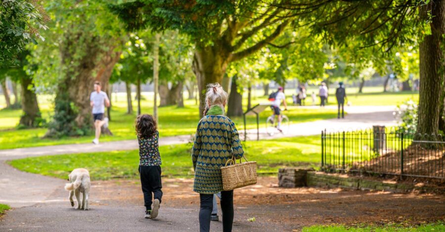 People walking through a park.