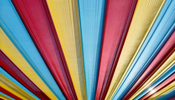 A colourful striped canopy in red, yellow and blue.