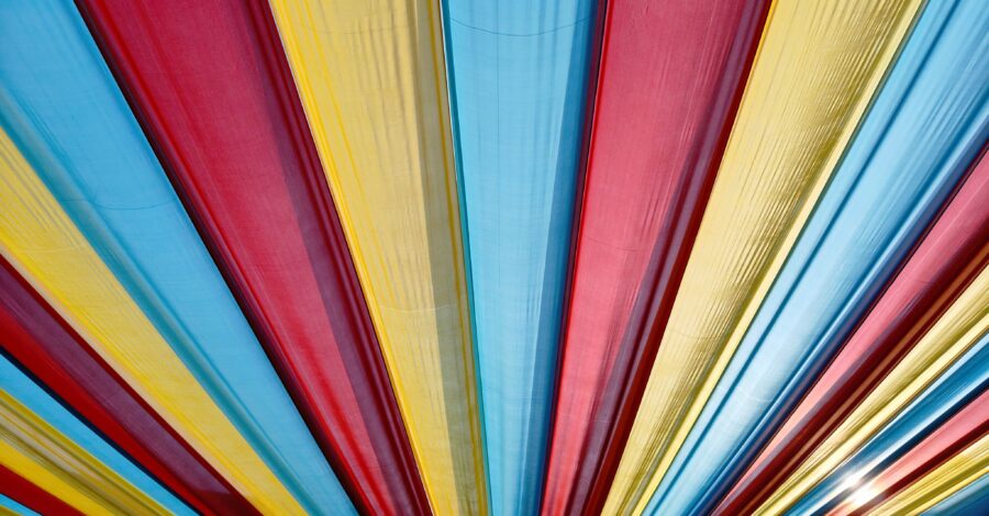 A colourful striped canopy in red, yellow and blue.